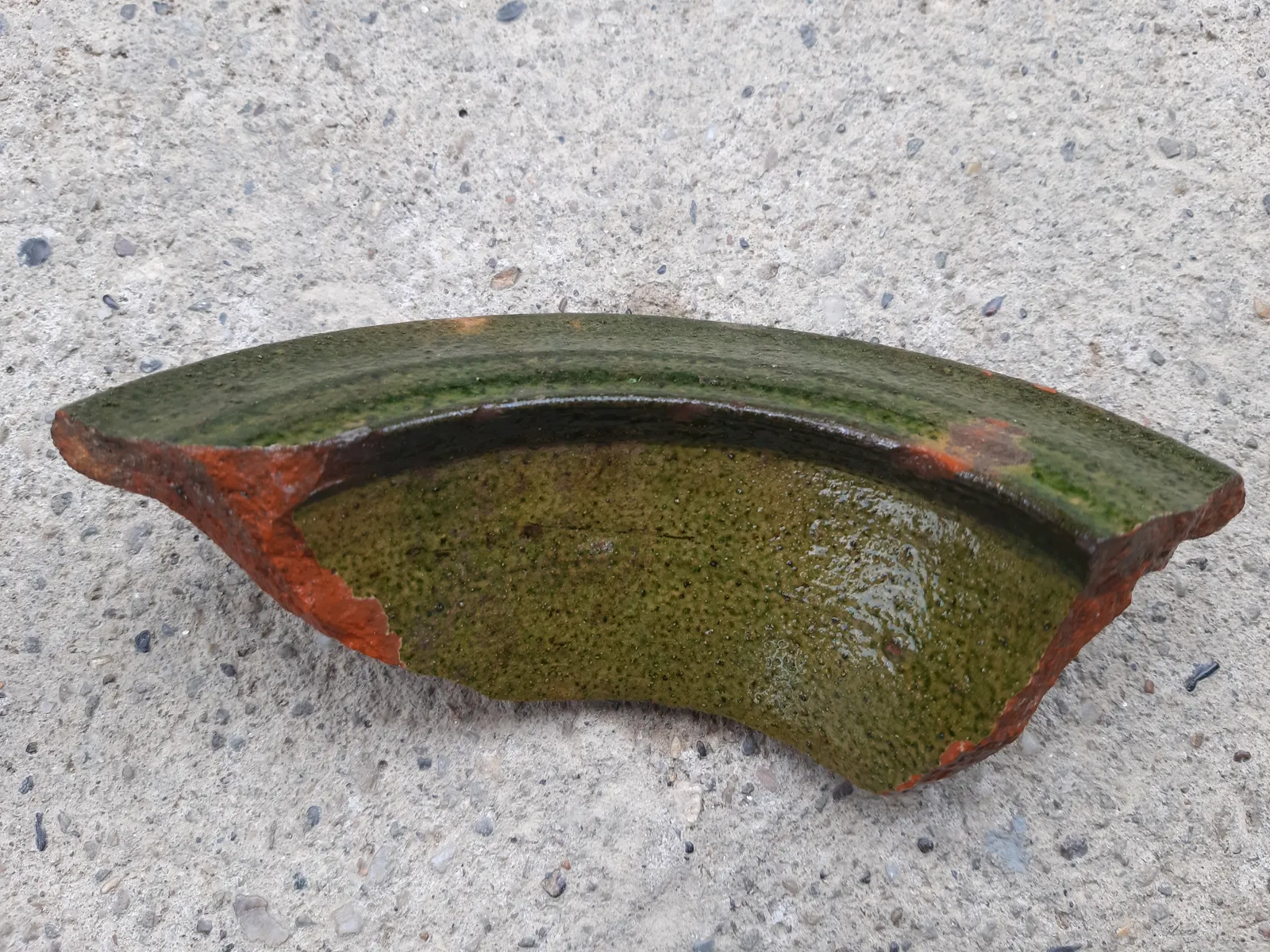 A green-glazed pottery fragment